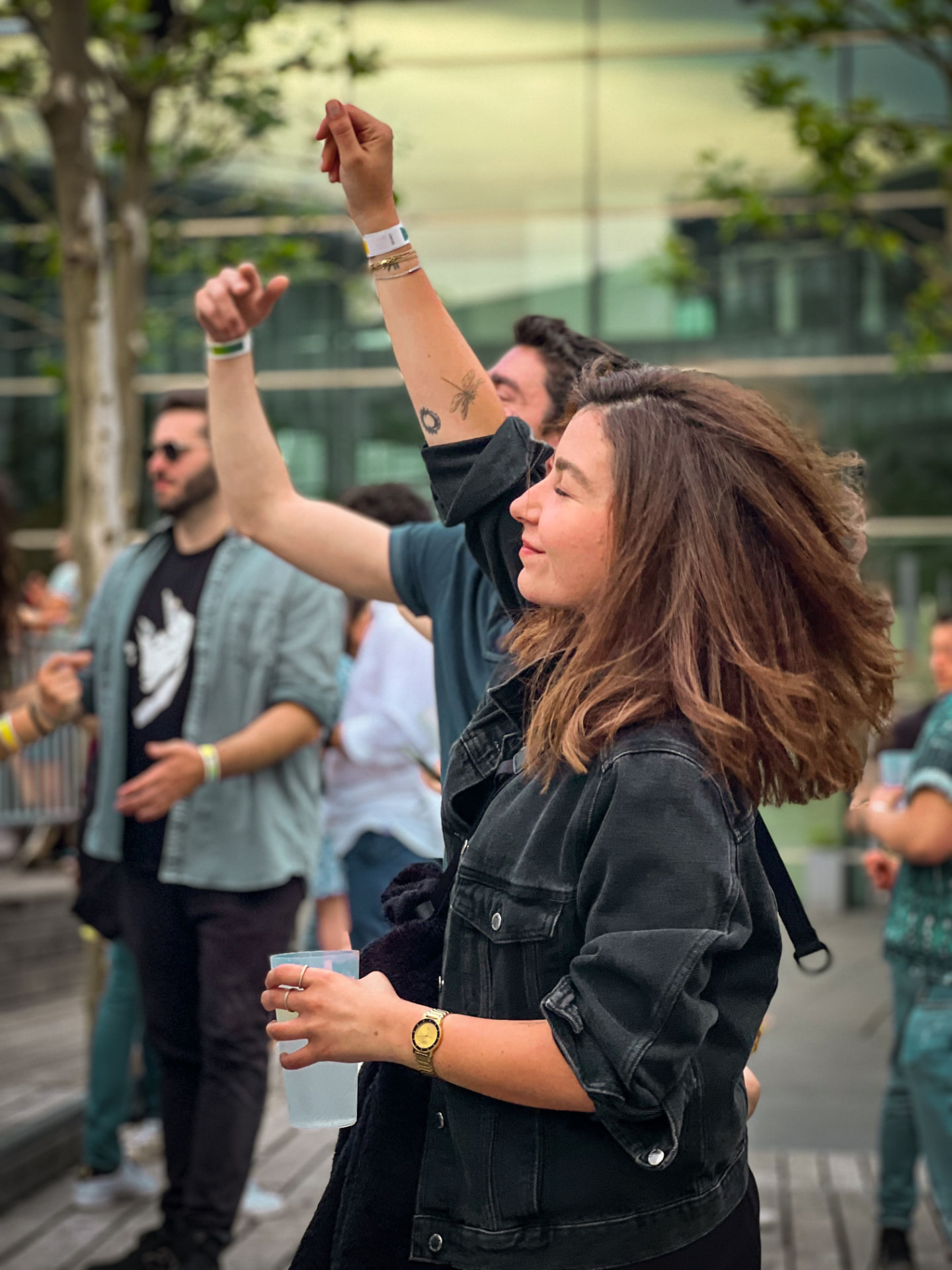 People dancing outdoors at an open-air gathering